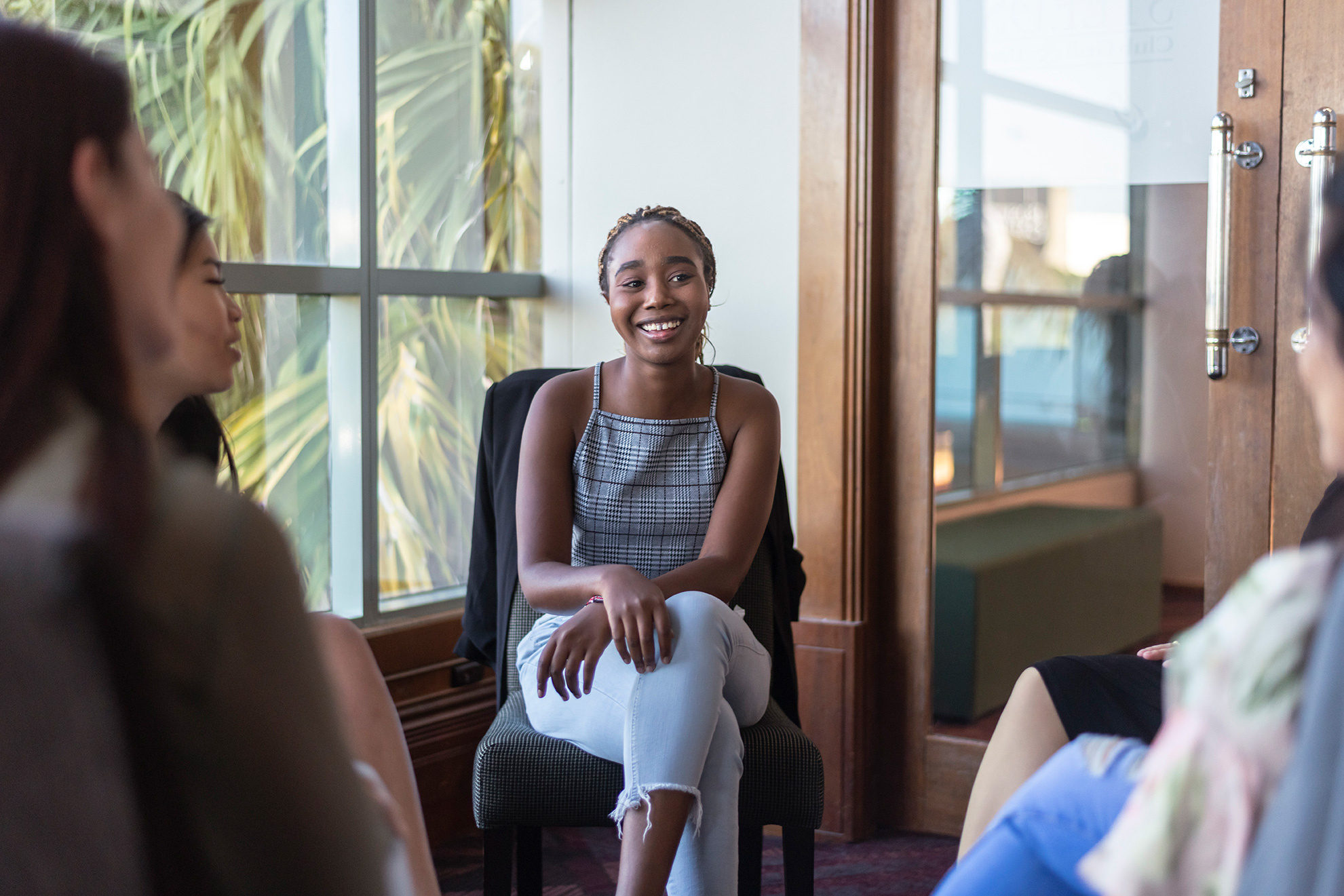 Black woman among a circle women